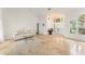 Bright and airy living room featuring travertine floors and views to the entryway at 836 Copperfield Ter, Casselberry, FL 32707