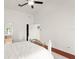 Spacious main bedroom with hardwood floors, ceiling fan, and ensuite bath at 836 Copperfield Ter, Casselberry, FL 32707