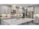 Bright kitchen featuring an island, stainless steel appliances, and pendant lighting at 853 Junonia Blvd, New Smyrna Beach, FL 32168