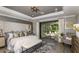 Spacious primary bedroom with sitting area and sliding glass door leading to screened outdoor space at 853 Junonia Blvd, New Smyrna Beach, FL 32168