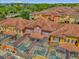 Aerial view showcasing colorful townhomes, each featuring its own private screened-in pool at 8972 Coco Palm Rd, Kissimmee, FL 34747