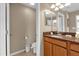 Bathroom with a toilet, single sink and vanity at 8972 Coco Palm Rd, Kissimmee, FL 34747