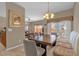 Bright dining room with a large table, bench seating, and views of the outdoor patio at 8972 Coco Palm Rd, Kissimmee, FL 34747