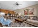 Cozy living room and kitchen area with modern furnishings and ample seating at 8972 Coco Palm Rd, Kissimmee, FL 34747