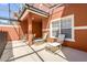 Outdoor patio with lounge chairs, table with chairs, and views of the property at 8972 Coco Palm Rd, Kissimmee, FL 34747