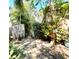 Charming backyard pathway with lush landscaping is a tranquil escape surrounded by natural beauty and charm at 913 Red Fox Rd, Altamonte Springs, FL 32714