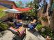 Whimsical backyard seating area with colorful decor and tropical foliage at 913 Red Fox Rd, Altamonte Springs, FL 32714
