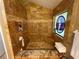 Luxurious bathroom with tiled walls, a glass shower, and natural light at 913 Red Fox Rd, Altamonte Springs, FL 32714