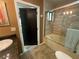 Bathroom area showcasing a bath with glass panel at 913 Red Fox Rd, Altamonte Springs, FL 32714