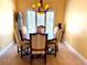 Inviting dining area with a classic chandelier and large window for natural light at 913 Red Fox Rd, Altamonte Springs, FL 32714