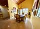 Bright dining room with wood floors, coffered ceilings, a chandelier, and natural light from the large windows at 913 Red Fox Rd, Altamonte Springs, FL 32714