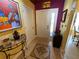 Warm foyer featuring a tiled floor, decorative mosaic inlay, and an eclectic array of art and decor at 913 Red Fox Rd, Altamonte Springs, FL 32714