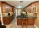 Well-equipped kitchen featuring custom cabinets and a functional island with breakfast bar at 913 Red Fox Rd, Altamonte Springs, FL 32714