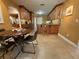 Open kitchen featuring wood cabinets, tiled floors, and a breakfast bar with seating at 913 Red Fox Rd, Altamonte Springs, FL 32714