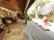 Living room offers eclectic decor, tile floors, backyard access, and ceiling fans at 913 Red Fox Rd, Altamonte Springs, FL 32714