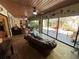 Beautiful living room opens to backyard and includes tile floors, custom decor, and ceiling fans at 913 Red Fox Rd, Altamonte Springs, FL 32714