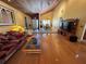Open-concept living room boasts vaulted ceilings, hardwood floors, and ample natural light at 913 Red Fox Rd, Altamonte Springs, FL 32714