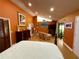 Inviting bedroom with vaulted ceiling, wood floors, art collection and natural light at 913 Red Fox Rd, Altamonte Springs, FL 32714