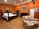 Spacious bedroom featuring a hardwood floor and a cozy sitting area at 913 Red Fox Rd, Altamonte Springs, FL 32714