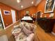Bright bedroom with a floral chair, hardwood floors, and an artistic flair at 913 Red Fox Rd, Altamonte Springs, FL 32714