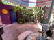 The patio is a relaxing oasis, surrounded by vibrant foliage and colorful decor, with canvas awning at 913 Red Fox Rd, Altamonte Springs, FL 32714