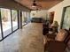 Enclosed lanai boasts large windows and travertine tile floors offering backyard views at 913 Red Fox Rd, Altamonte Springs, FL 32714