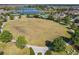 Vast green space with walking paths, pool and lake, surrounded by beautiful homes in the community at 9432 Komika Ln, Winter Garden, FL 34787