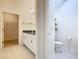 Bathroom view includes the open closet to the left and toilet to the right at 9432 Komika Ln, Winter Garden, FL 34787
