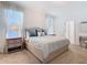 This bedroom features a queen bed with two nightstands at 9432 Komika Ln, Winter Garden, FL 34787
