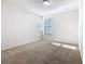 This bedroom has carpet and two windows at 9432 Komika Ln, Winter Garden, FL 34787