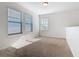 This bedroom has carpet flooring, neutral walls, and three windows with privacy blinds at 9432 Komika Ln, Winter Garden, FL 34787