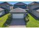 Charming one-story home featuring a two car garage, well-manicured lawn and paver driveway at 9432 Komika Ln, Winter Garden, FL 34787