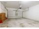 Open garage showcasing ample space and an automatic garage door, ready for parking at 9432 Komika Ln, Winter Garden, FL 34787