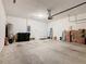 Spacious garage with room for storage and vehicles, complete with a garage door opener at 9432 Komika Ln, Winter Garden, FL 34787