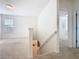 Upstairs hallway with carpet, leading to carpeted rooms, and a staircase to the main floor at 9432 Komika Ln, Winter Garden, FL 34787