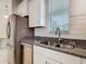 Modern kitchen featuring stainless steel appliances, granite countertops, and white cabinetry at 9432 Komika Ln, Winter Garden, FL 34787