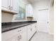 Convenient utility room features stylish cabinets, granite countertops, and a bright window at 9432 Komika Ln, Winter Garden, FL 34787