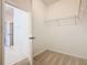 A roomy walk-in closet leads to the bathroom, complete with wire shelving at 9432 Komika Ln, Winter Garden, FL 34787