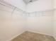 Ample storage in a walk-in closet, equipped with sturdy wire shelving at 9432 Komika Ln, Winter Garden, FL 34787