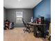 Functional bedroom space with a desk setup, ideal for work or gaming, and a cozy carpet at 1059 Cypress Fox Blvd, Davenport, FL 33897
