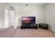 The carpeted living room features an archway, television and shelving at 1059 Cypress Fox Blvd, Davenport, FL 33897