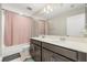 Bright bathroom featuring a double vanity, tub, and shower with neutral color tones at 1118 Franklin Tree Ln, Sanford, FL 32771