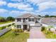 Beautiful two-story home with a brick driveway and well-manicured landscaping at 1118 Franklin Tree Ln, Sanford, FL 32771