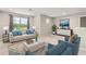 Bright living room with comfortable seating, neutral walls, and a view to the outside at 1118 Franklin Tree Ln, Sanford, FL 32771