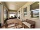Covered patio with brick flooring, screened enclosure, and wicker furniture at 1118 Franklin Tree Ln, Sanford, FL 32771