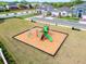 Community playground with a climbing structure, slide and benches at 1118 Franklin Tree Ln, Sanford, FL 32771