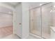 Bathroom featuring a glass enclosed shower and doorway to a closet at 1211 Normandy Dr, Haines City, FL 33844