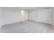 Bright bedroom with neutral walls, carpet, and ample closet space, offering a serene and spacious atmosphere at 1211 Normandy Dr, Haines City, FL 33844