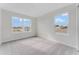Bright bedroom featuring two large windows and neutral carpeting with plenty of natural light at 1211 Normandy Dr, Haines City, FL 33844