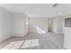 Spacious living room with large windows, neutral carpet, and ample natural light at 1211 Normandy Dr, Haines City, FL 33844